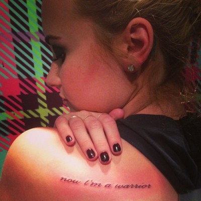 Demi Lovato’s “Now I’m a Warrior” Tattoo on Her Shoulder