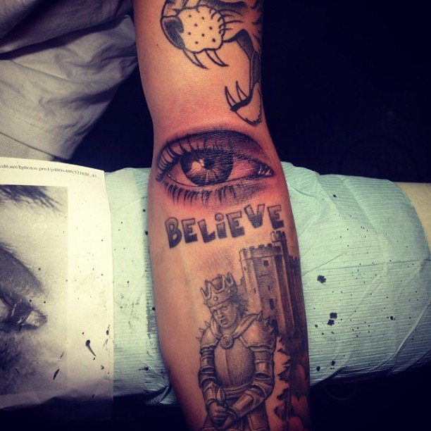 eyes forearm tattoo