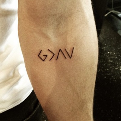 Nick Jonas Reveals New Religious Arm Tattoo