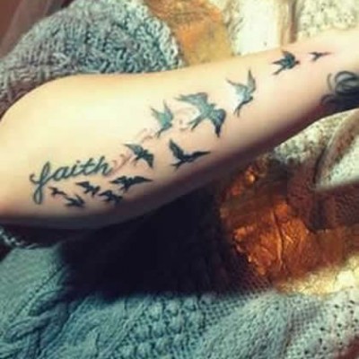 Demi Lovato’s String of Birds Tattoo on Her Arm