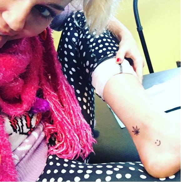 Miley Cyrus Celebrates Holiday Season with New Marijuana Leaf Tattoo-  PopStarTats
